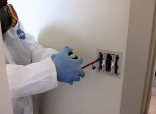 Treating the void behind an electrical outlet plate
