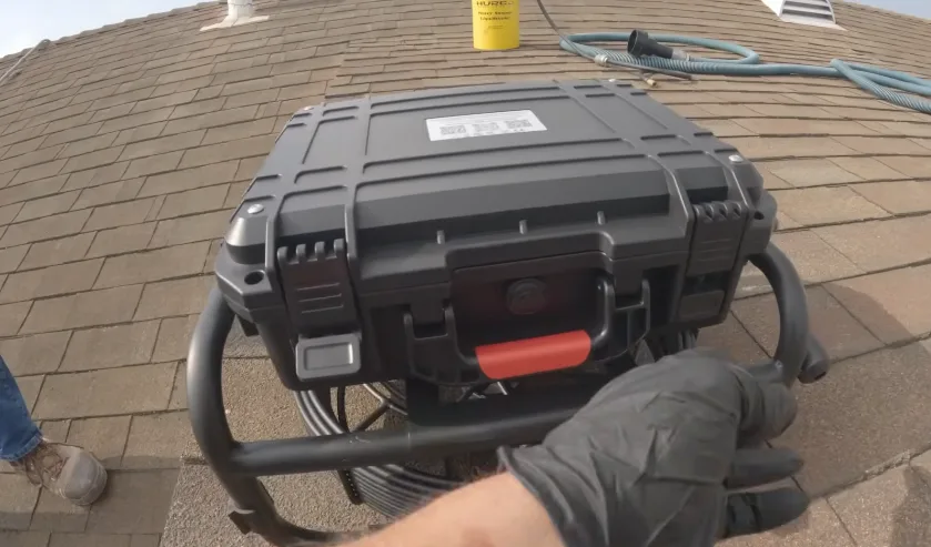 Equipment case carried onto a shingle roof for roof line work