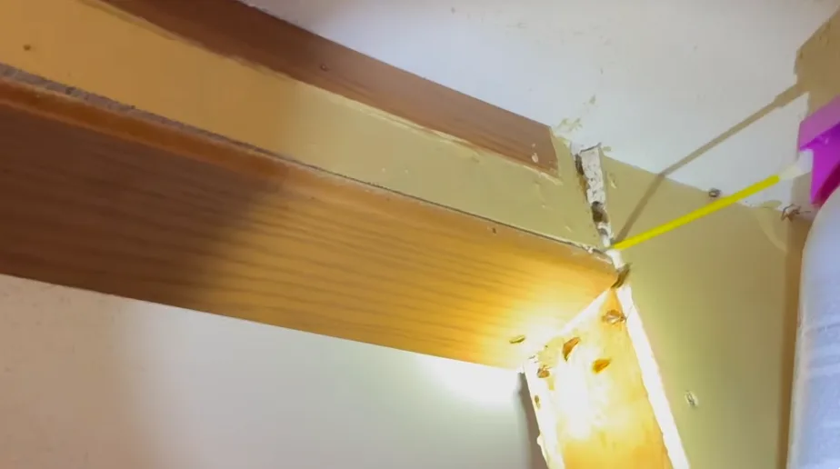 Treating the gap where a door frame meets the wall above head height