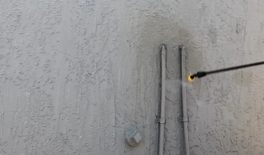 Treating around pipe penetrations where conduit passes through a stucco wall
